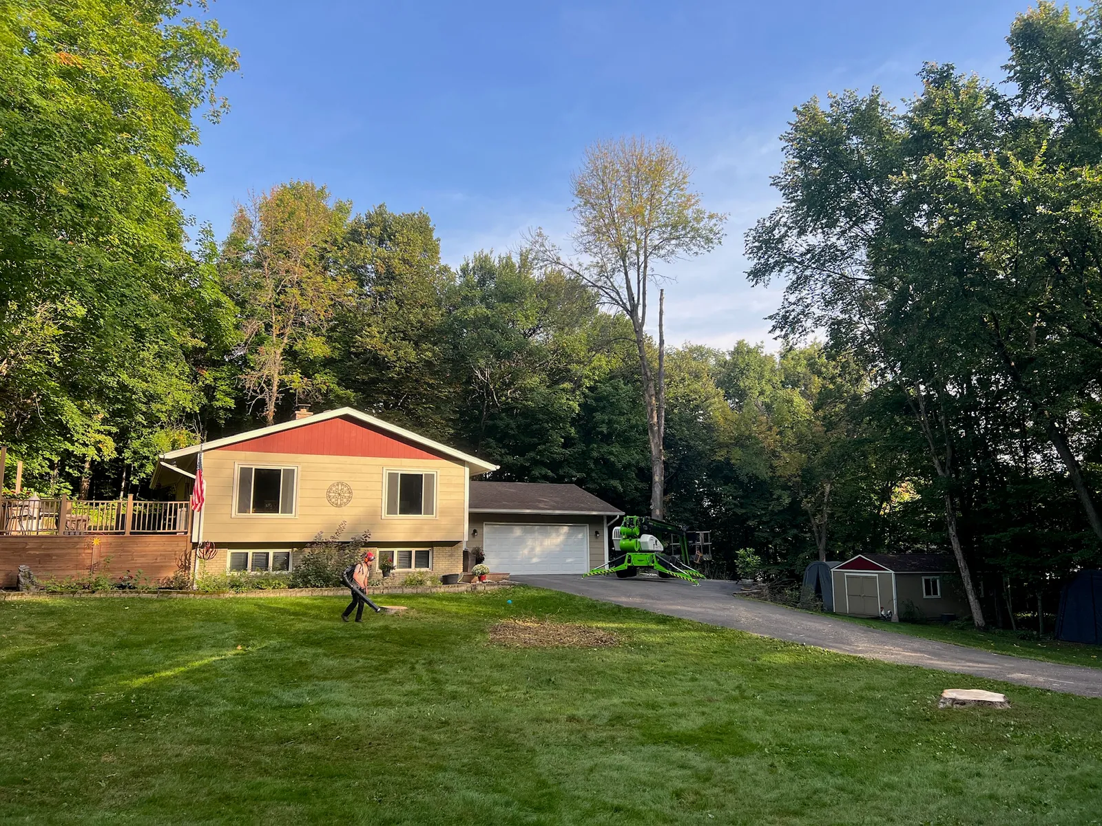 TreeTec lift set up on a driveway for an ash removal in Waconia, Minnesota